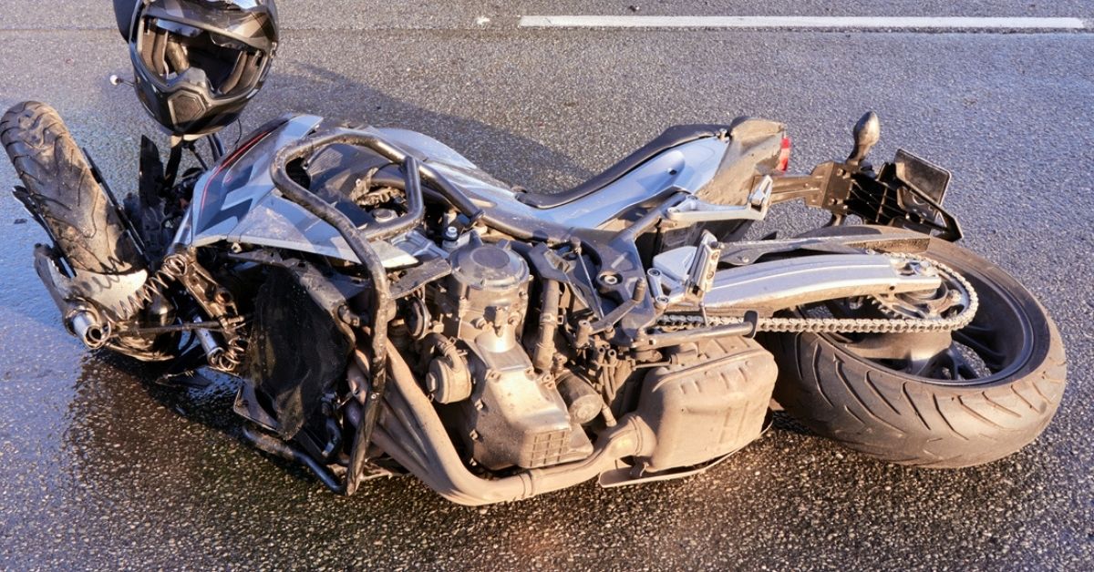 Damaged motorcycle on an Arizona road at the scene of an accident.
